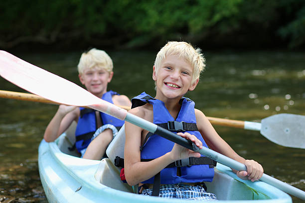 istock Two happy boys enjoying kayak on the river 507031441
