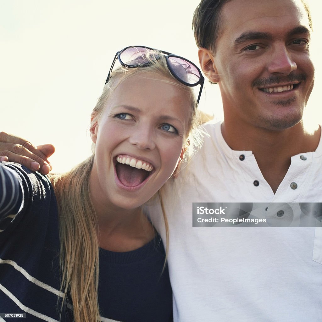 Excited young couple An excited young couple having a good time outdoors Adult Stock Photo