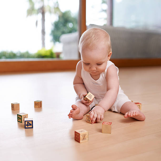 Shot of a cute and adorable baby boy at home