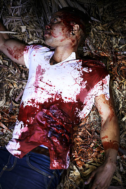 Senseless death A cropped shot of a murder victim found outdoors killing photos stock pictures, royalty-free photos & images