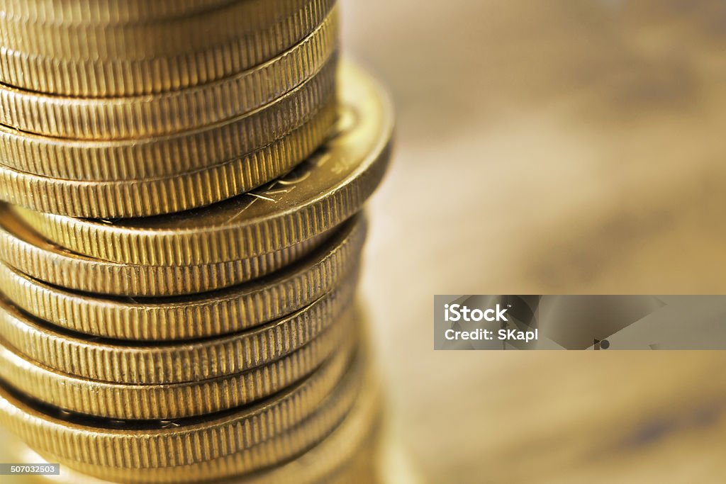 Golden coins Pile of golden coins with copy space on the right. Abstract Stock Photo