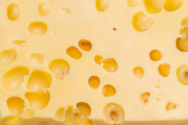 istock Texture of Swiss-type cheese with cheese's eyes 507033464