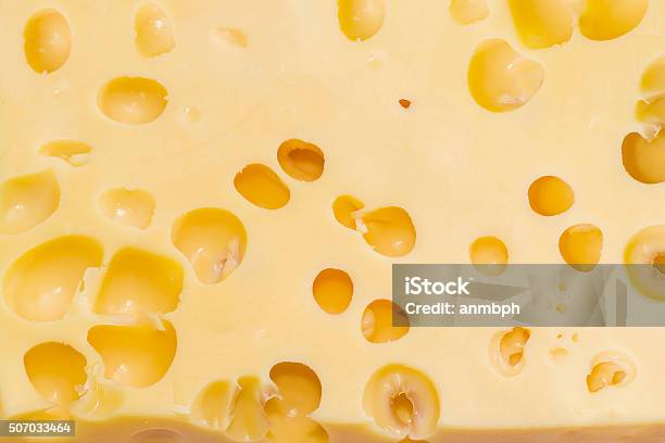 Texture Of Swisstype Cheese With Cheeses Eyes Stock Photo - Download Image Now - Agriculture, Animal, Backgrounds