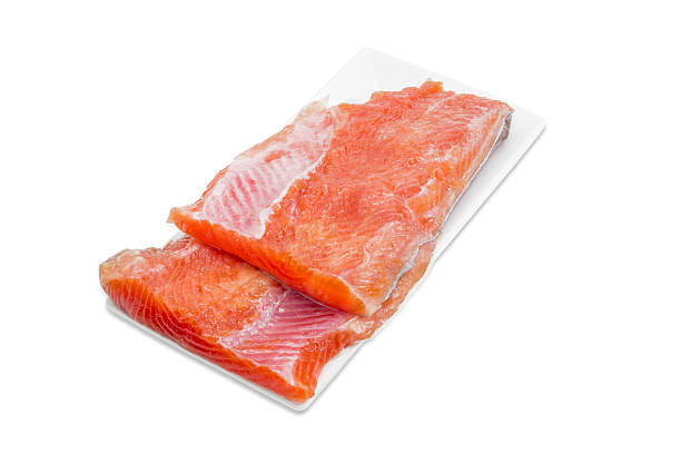istock Uncooked fillet of rainbow trout on a rectangular dish 507033658