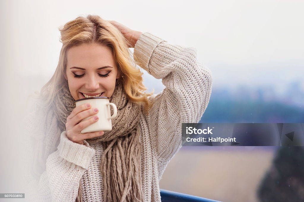 Beautiful woman relaxing Beautiful woman relaxing at home with cup of  coffee Women Stock Photo
