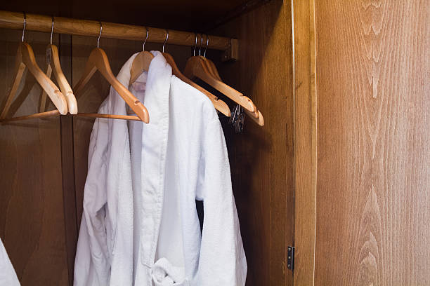 istock White Hotel gown on a hanger in the wardrobe 507033846