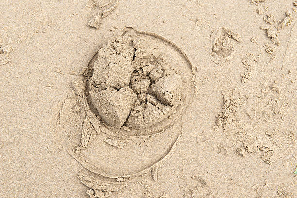 Top view of a sand castle made on wet white sand on the central coast of Australia