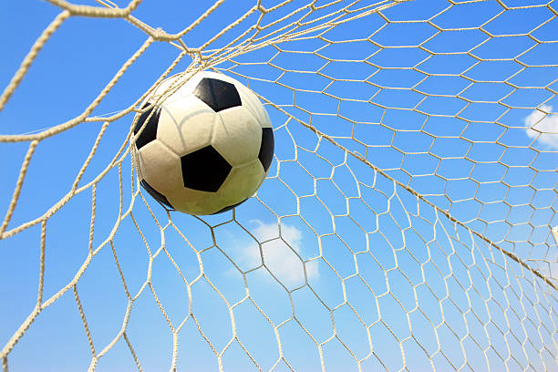 istock soccer ball in net 507034563