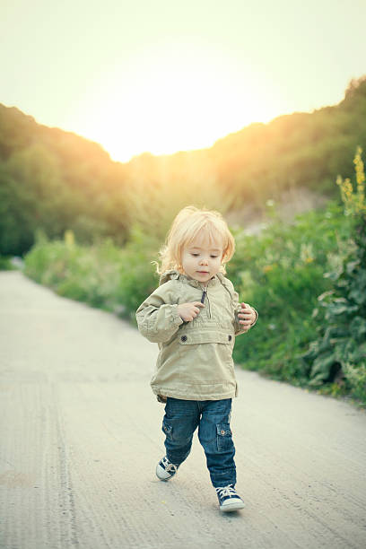 istock Little boy running in nature 507035416