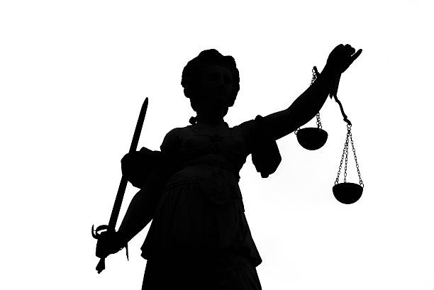 istock Shadow of Justice Statue 507035466