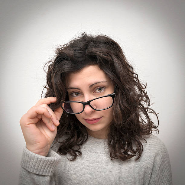 istock Girl looking through glasses 507036518
