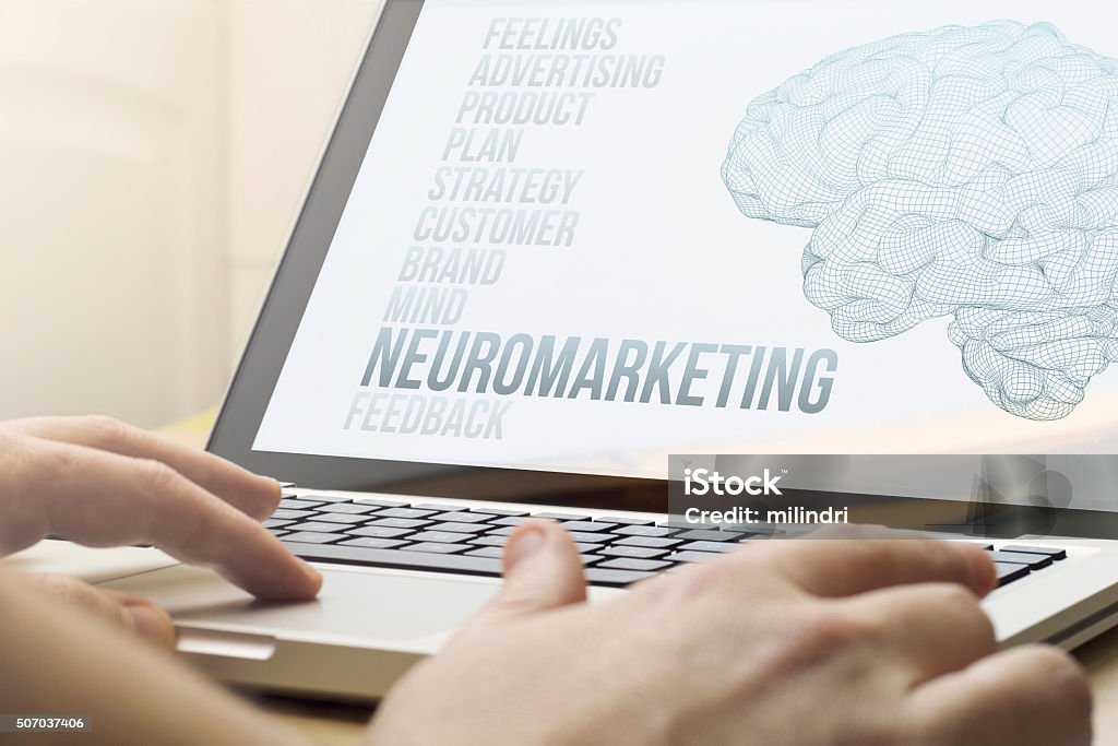 home computing neuromarketing modern marketing concept concept: man using a laptop with neuromarketing on the screen. Screen graphics are made up. Marketing Stock Photo