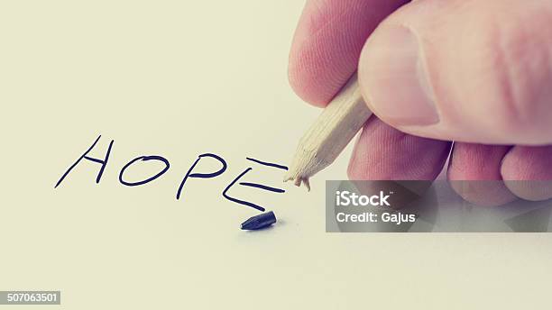 Man Writing The Word Hope On Notepaper Stock Photo - Download Image Now - Adult, Anticipation, Aspirations