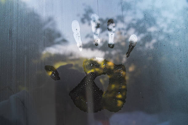 istock Hand print on hazy glass in the morning 507066680