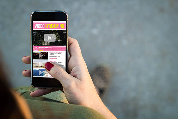 istock Woman walking smartphone video streaming 507067136
