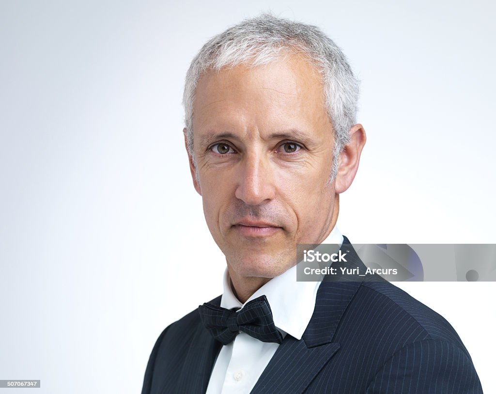 He's all dressed up A man wearing a suit and bow tie Full Suit Stock Photo