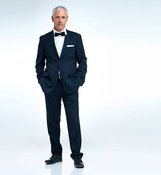 Looking swanky A studio shot of a mature man in a tuxido tuxedo stock pictures, royalty-free photos & images