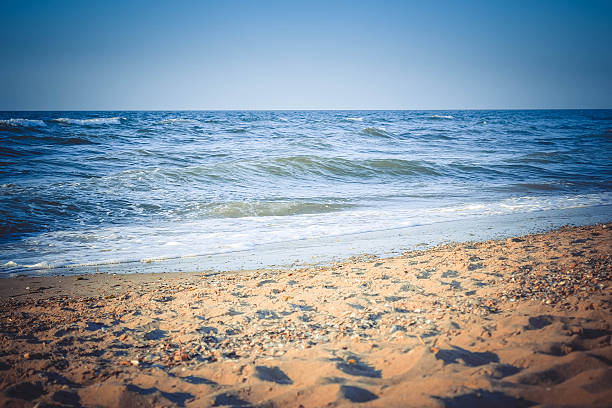 istock blue sea and yellow sand beach 507068632