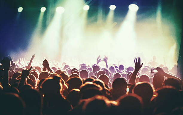 istock People at concert party. 507069554