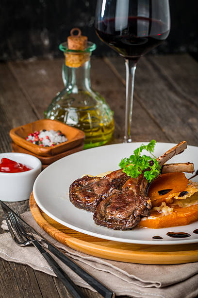 istock Roasted lamb ribs with  grilled pumpkin 507071132