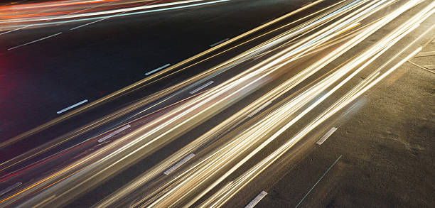 Long exposure light trails across road junction Long exposure light trails across road junction long shutter speed stock pictures, royalty-free photos & images