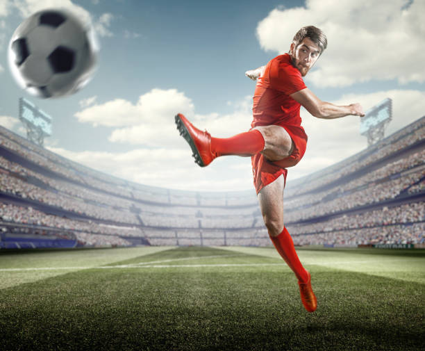 istock Soccer player kicking ball in stadium 507073392