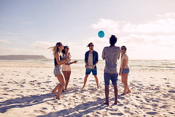 istock Young people playing with ball at the beach 507073426