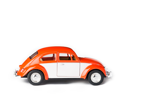 Ski, Norway - January 28, 2016: An orange VW toy car. Also known as beetle.