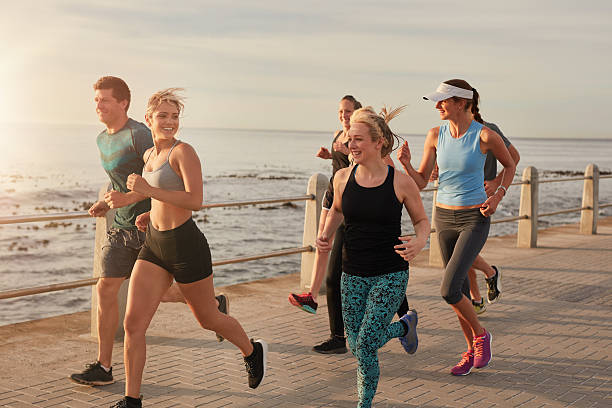 istock Young people running by the sea 507075070