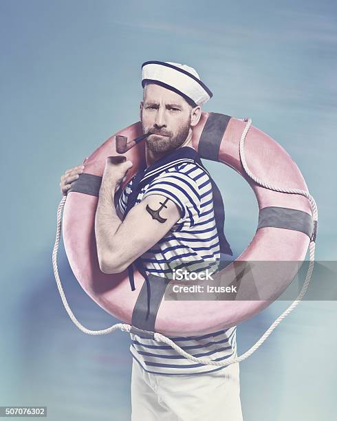 Bearded Sailor Holding Lifebuoy And Smoking Pipe Stock Photo - Download Image Now - Sailor, Sailor Suit, Tattoo