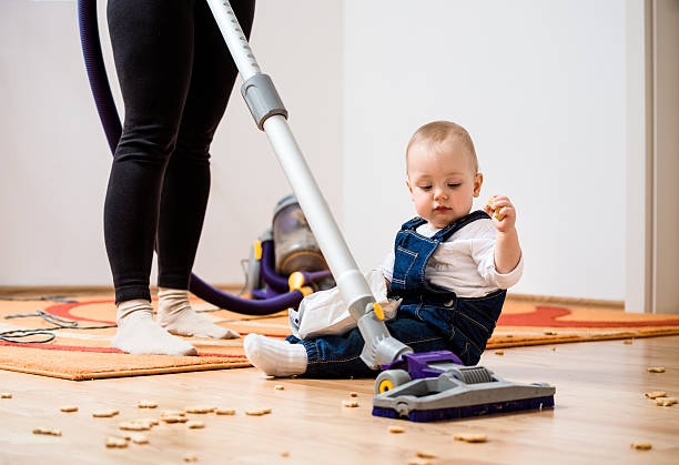 Cleaning home - mother and child stock photo