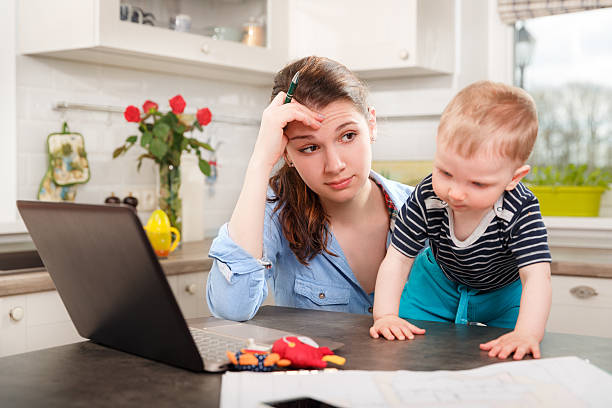 istock Young mother working with her baby 507076958