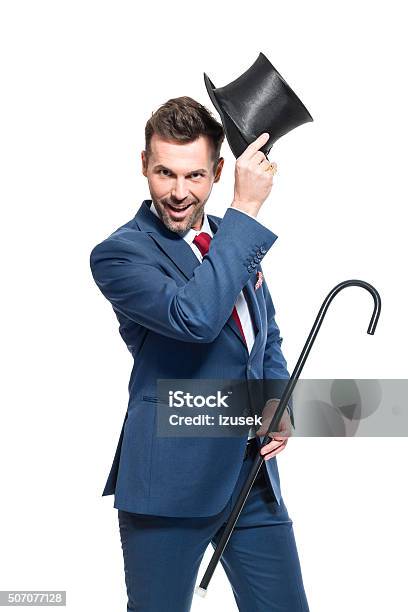 Charming Businessman Wearing Suit And Cylinder Hat Stock Photo - Download Image Now - Magician, Wizard, Men