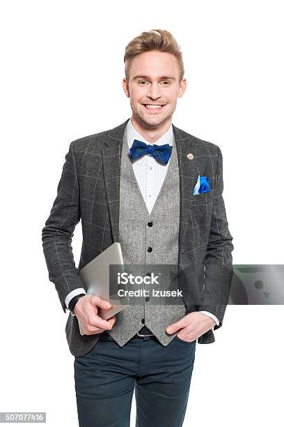 Fashionable Young Businessman In Classical Outfit Holding A Digital Tablet Stock Photo - Download Image Now