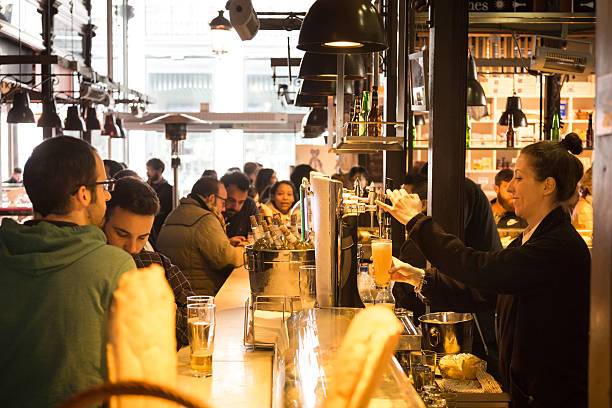 Madrid, Spain - Jan 25, 2016:  People eat and drink at Mercado San Miguel on January 25th, 2016 in Madrid, Spain. According to Tripadvisor it is one of top tourist sites in Madrid.