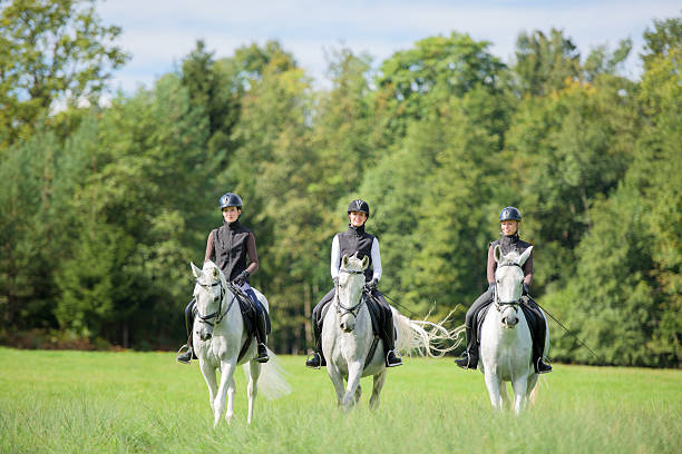 istock Women riding horses 507081942
