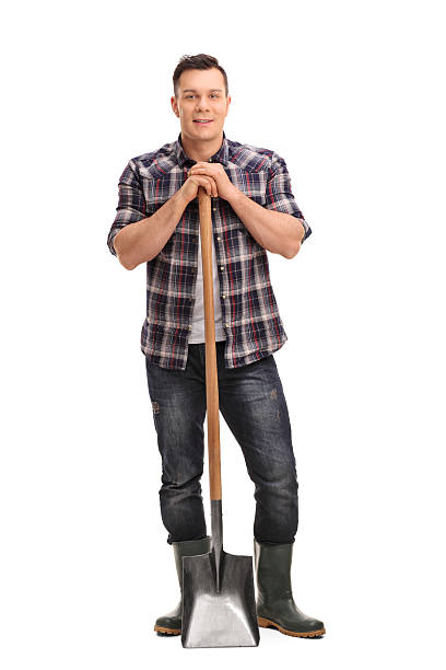 istock Young agricultural worker posing with a shovel 507082692