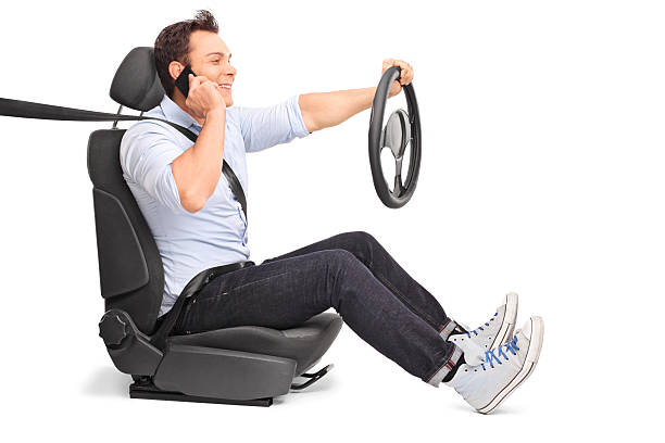 istock Young man driving and talking on phone 507083232