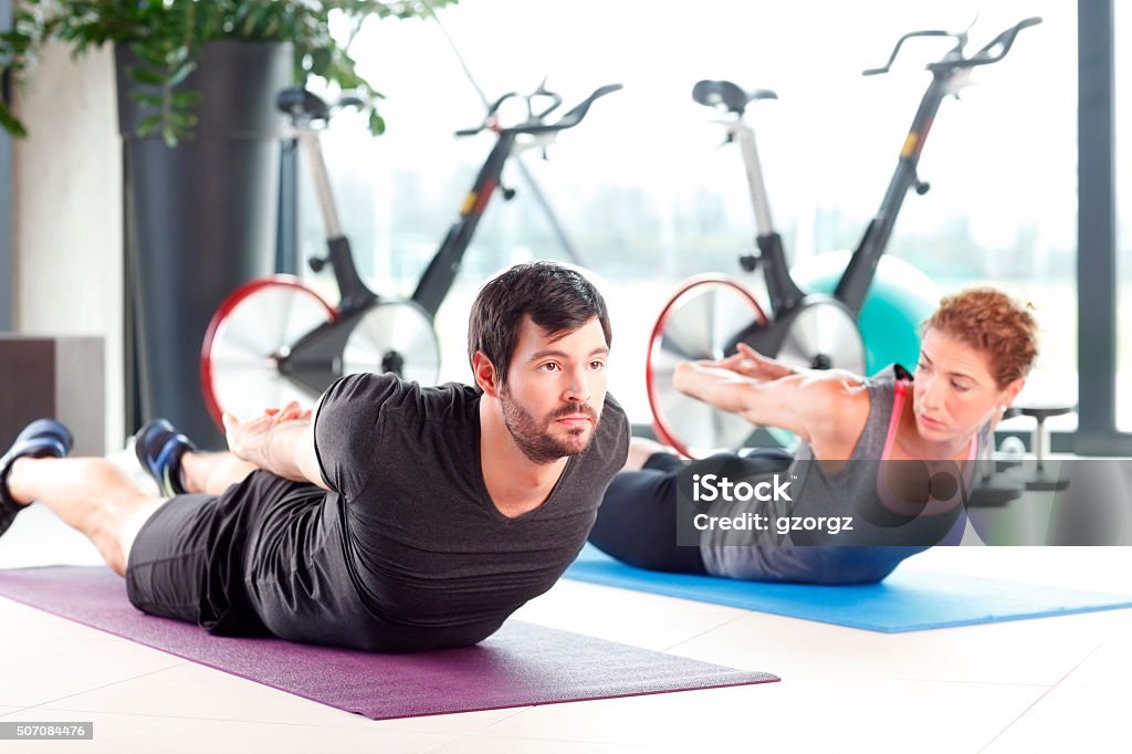 Workout at fitness club Portrait of a man and woman training together at the gym. Active Lifestyle Stock Photo