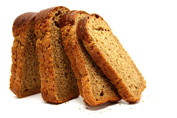 istock The cut loaf of bread isolated on white background 507089091