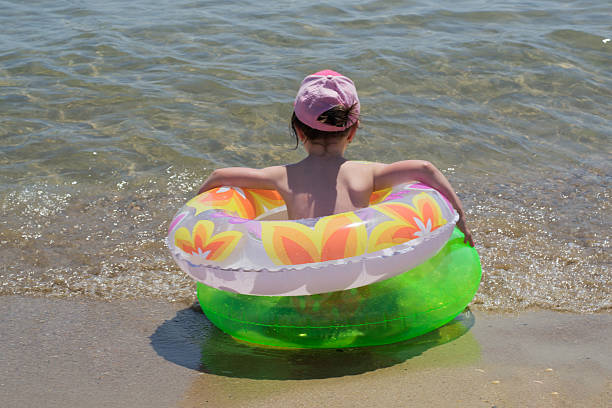 istock little girl on sea 507090935