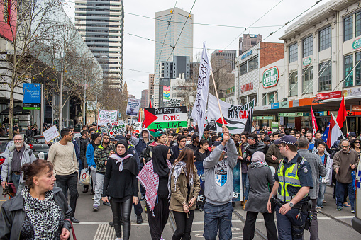 Melbourne, Australia - July 19, 2014: Protesters chanting at a protest in Melbourne against Israeli attacks on Gaza. 