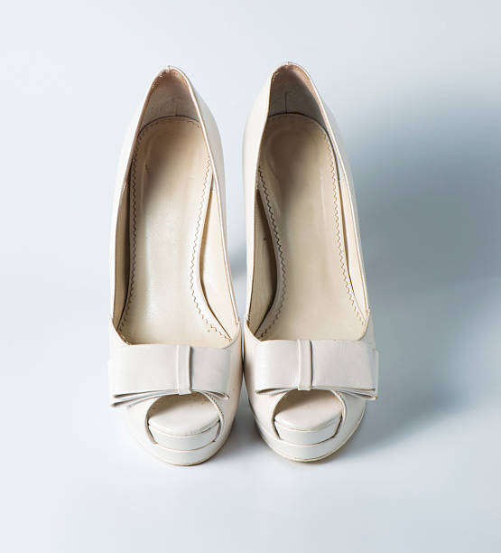 istock Woman white shoes on white 507093203