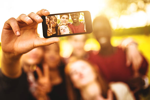 istock Group of college student laughing and doing a selfie 507094163