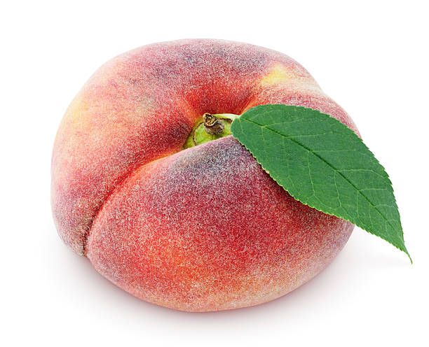 Chinese flat donut peach with leaf on white Chinese flat donut peach with leaf isolated on white with clipping path paraguay stock pictures, royalty-free photos & images