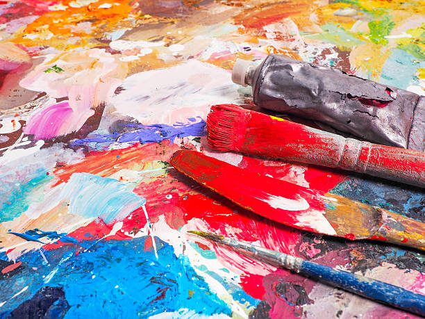 istock Brush and bright oil-paint palette for background 507106526