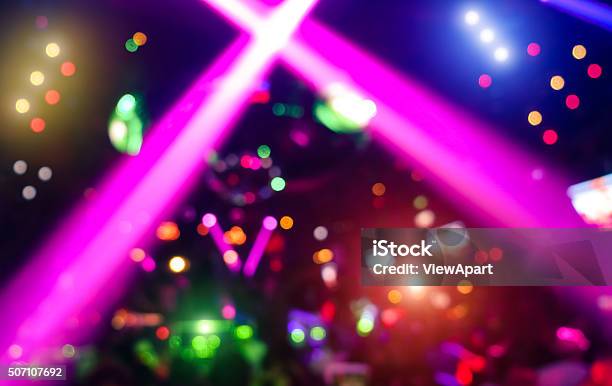 Abstract Background With Defocused Bokeh Laser Show In Modern Nightclub Stock Photo - Download Image Now