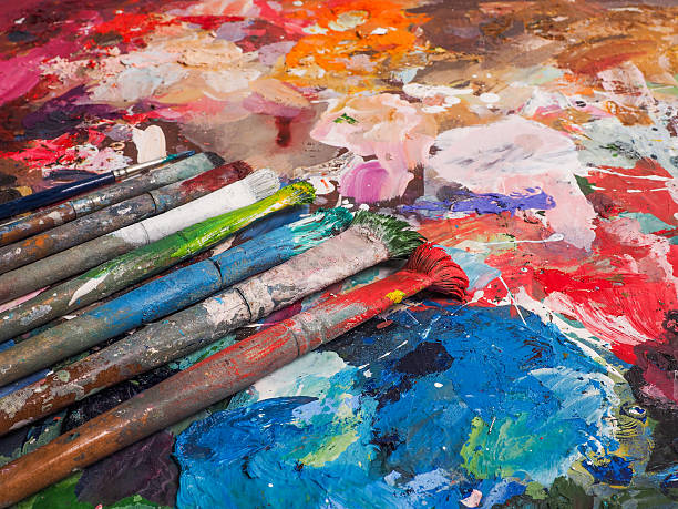 istock Brush and bright oil-paint palette for background 507108092