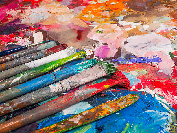 istock Brush and bright oil-paint palette for background 507108218
