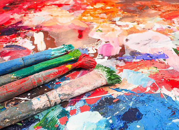 istock Brush and bright oil-paint palette for background 507108834